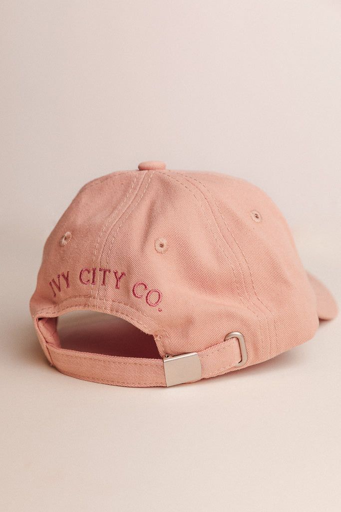 Introducing the first ever Ivy MERCH! We've poured our hearts and souls into these darling hats and hope you love them as much as we do! Available in our signature Ivy pink and a beautiful shade of sage, featuring our classic embroidered logo. And did we mention there's a matching mini version?! Pink Fitted Hat With Curved Brim, Pink Cotton Hat With Embroidered Logo, Pink Hat With Flat Brim, Pink Flat Brim Hat, One Size Fits Most, Flat Brim Pink Hat One Size, Pink Fitted Hat With Flat Brim, Pink Cotton Hat With Curved Bill, Pink Cotton Curved Bill Hat, Adjustable Short Brim Dad Hat For Spring