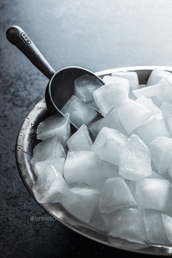 ice cubes in a bowl with a spoon - stock photo - images