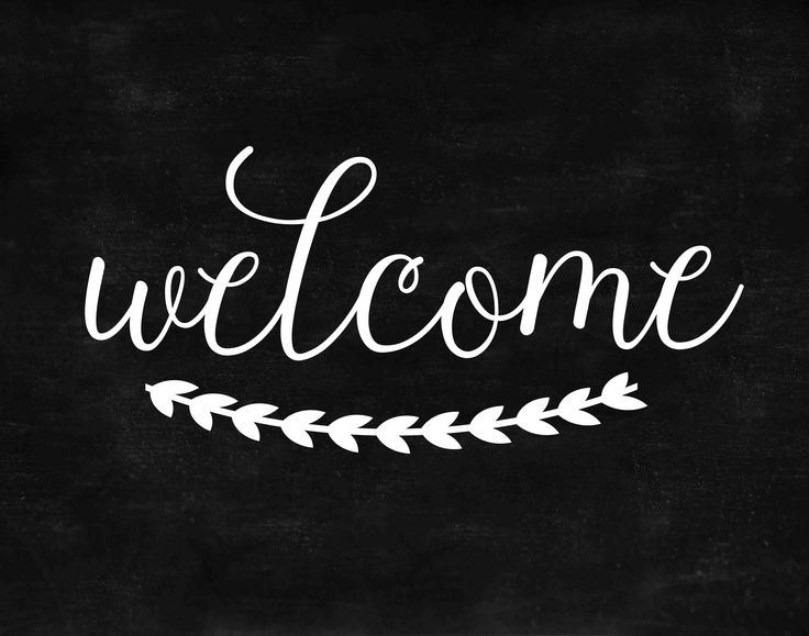 the word welcome written in white chalk on a blackboard with an arrow and leaves