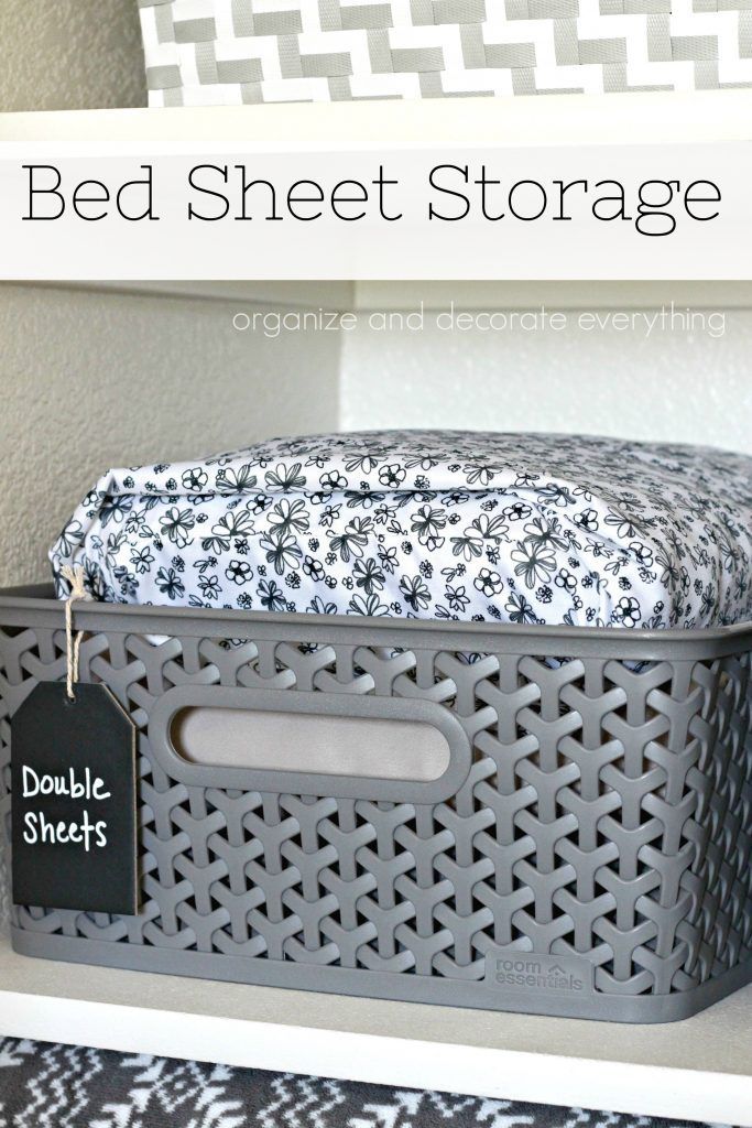 a bed sheet storage bin with a black and white label on the lid that says, bed sheet storage