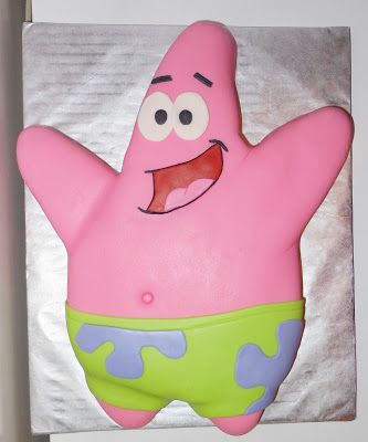 a cake shaped like a cartoon character is on display