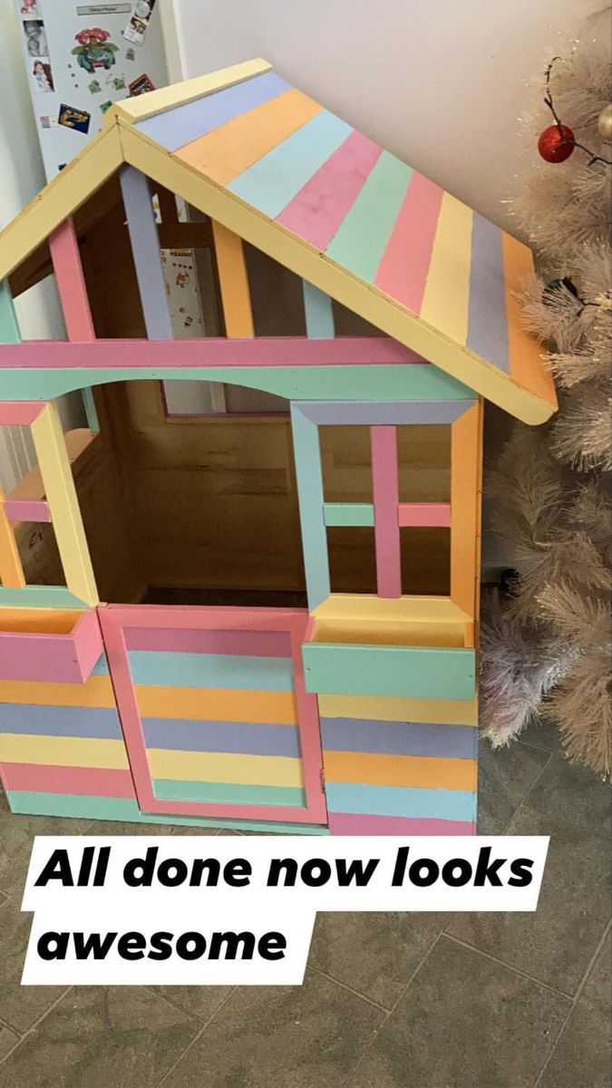 a colorful doll house with the words all done now looks awesome