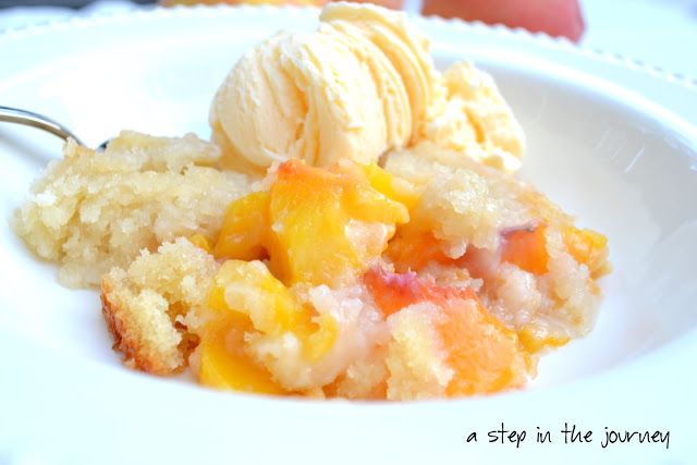 a close up of a plate of food with ice cream and fruit toppings on it