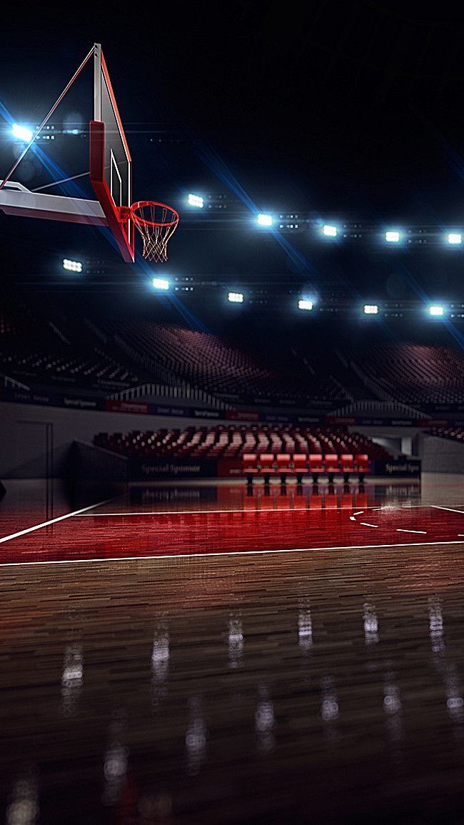 an empty basketball court with the lights on