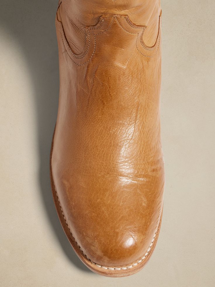 Made to last, the handsomely rugged Stetson Puncher boot is crafted by premium bootmakers using burnished leather with a soft leather lining and removable True X insoles for comfort.  Stetson artisans used 56 lemonwood pegs to withstand the elements Western Boots With Oiled Leather And Leather Sole, Western Oiled Leather Boots With Leather Lining, Leather Sole Moto Ankle Boots For Ranch, Moto Ankle Boots With Leather Sole For Ranch, Classic Moto Boots With Almond Toe And Leather Sole, Classic Moto Boots With Leather Sole And Almond Toe, Leather Sole Ankle Moto Boots For Ranch, Rugged Vegetable Tanned Leather Boots With Snip Toe, Rugged Calf Leather Boots With Plain Toe