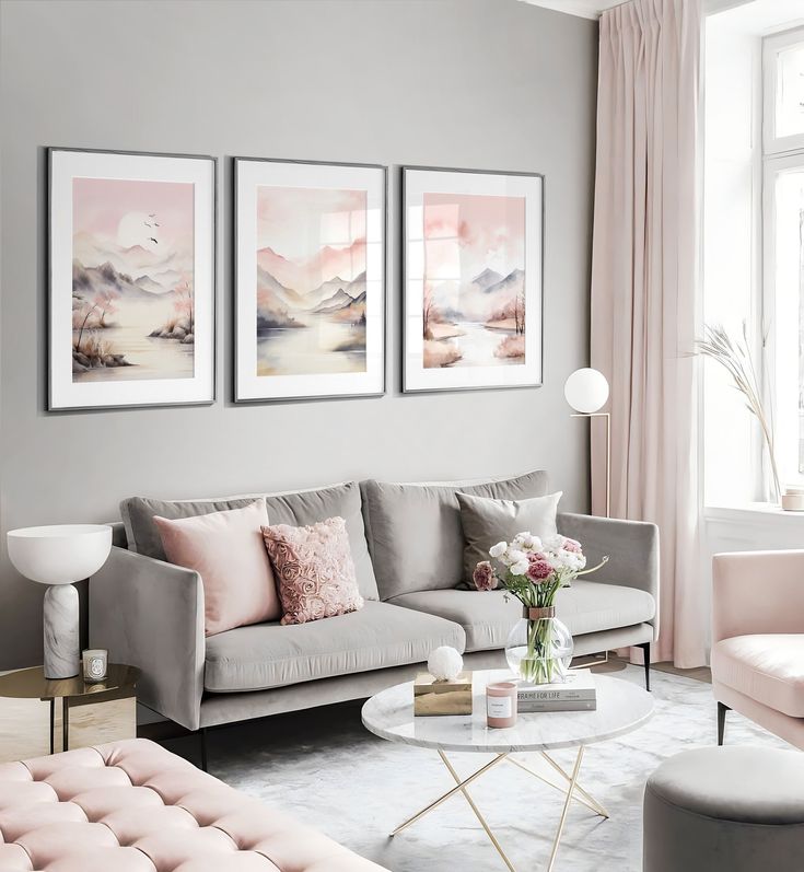 a living room filled with furniture and paintings on the wall above it's coffee table