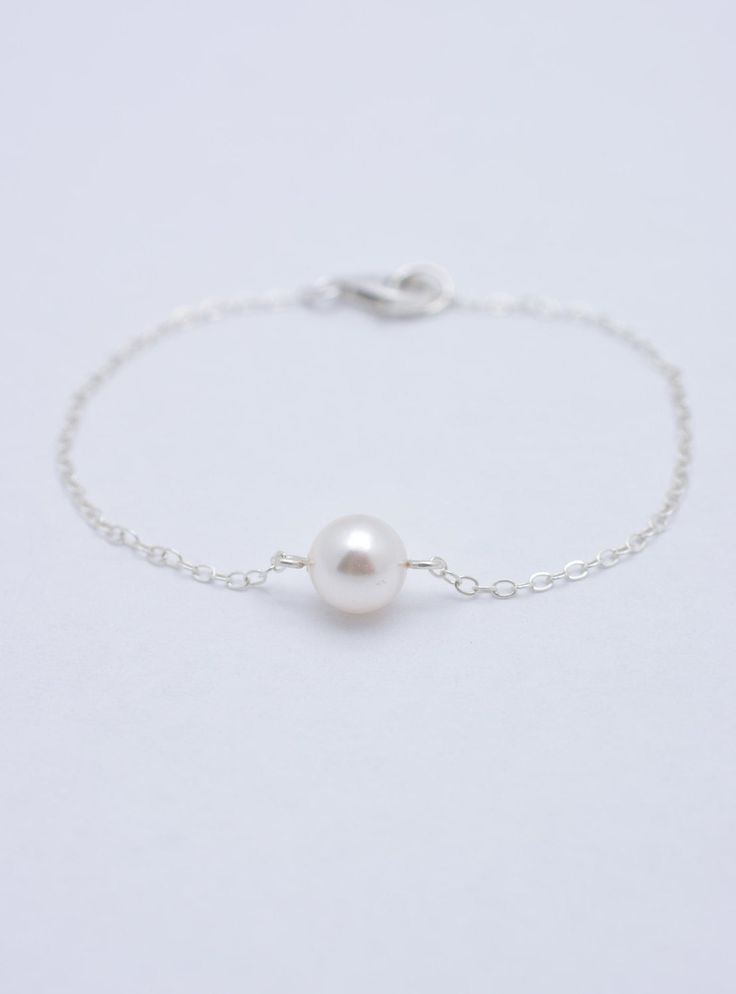 LISTING IS FOR ALL 4 PEARL BRACELETS: This set of 4 sterling silver bracelets is hand-crafted using 8mm Swarovski pearls and solid sterling silver chain. Each measures approximately 7 inches long** and secures with a silver lobster clasp. Each comes in a gift box. Pearl also in ivory, pink, light grey, and dark grey. **IMPORTANT: Measures 7 inches long but can be made in any length. Please specify preferred length(s) at checkout. See measuring instructions here: www.etsy.com/listing/203218247/br Bridesmaid Bracelets, Bridesmaid Pearl Bracelet, Bridal Statement Necklace, Silver Pearl Bracelet, Silver Bridesmaid, Pretty Jewelry Necklaces, Bracelet Set Silver, Wedding Bridesmaid Jewelry, Pearl Bracelets