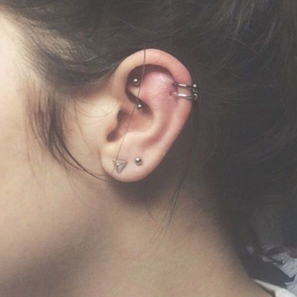 a woman with ear piercings on her ears