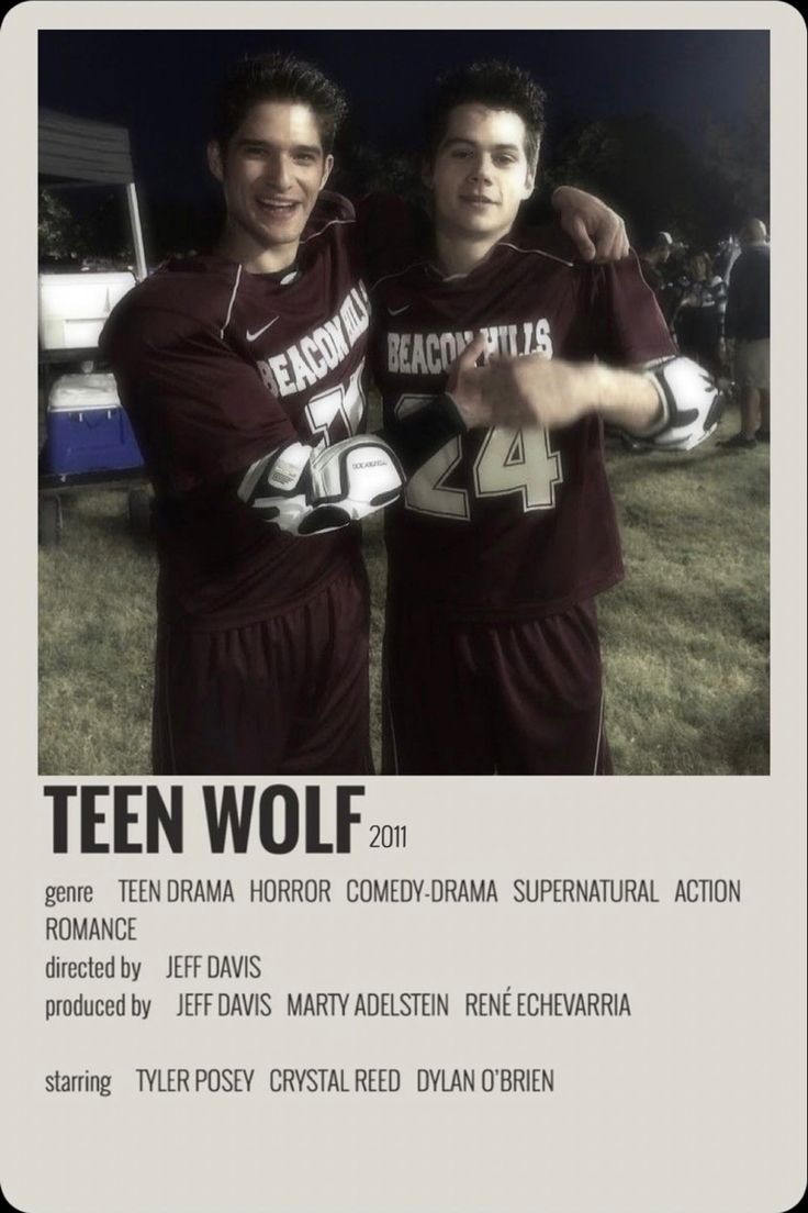 two young men standing next to each other in front of a white sign that says teen wolf