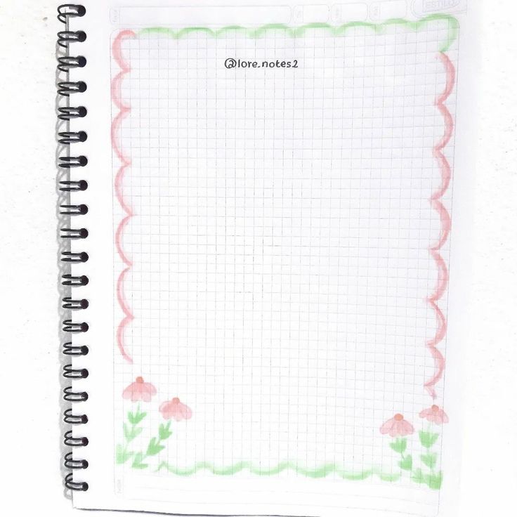 an open notebook with pink flowers on it