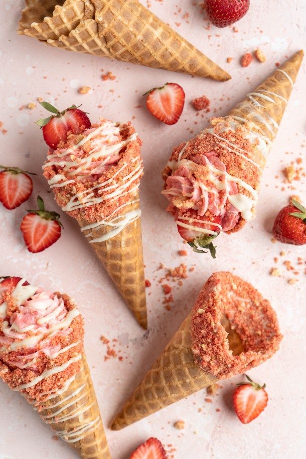 three ice cream cones with strawberries on top and the words gather all of your ingredients for this recipe