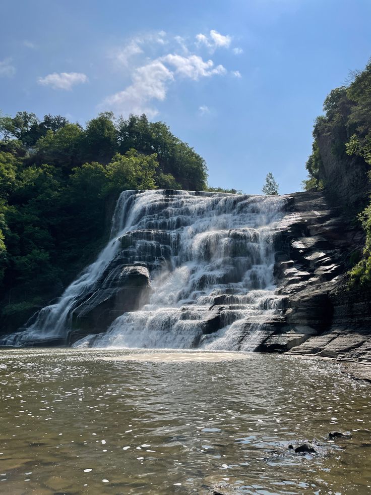 a large waterfall with lots of water coming out of it