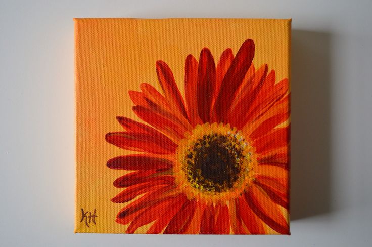 an orange and red flower painted on canvas