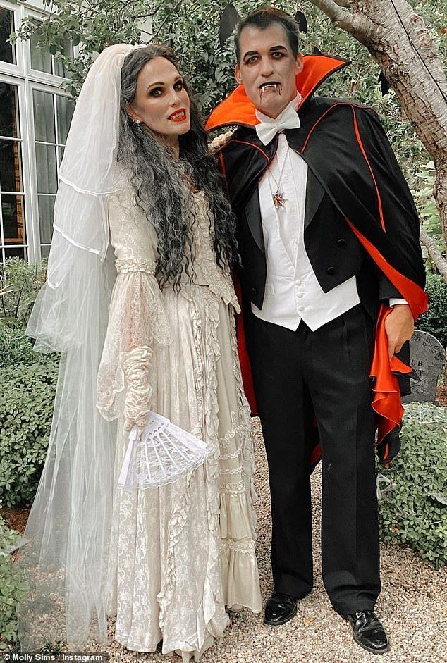 a man and woman dressed up as dracula and bride