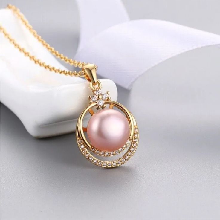 Gorgeous 11-12mm Real Genuine Pink Pearl On Gold Plated Over Stamped 925 Sterling Silver Pendant Necklace. Chain Measures 18” Inches. This Is Such A Pretty Necklace! New Condition And Comes In A Pink Gift Box. Bundle & Save: Bundle 2 Or More Items For A Private Discount Next Day Shipping On All Orders 5 Star Rated Poshmark Ambassador Pink Pearl Pendant Jewelry For Gift, Pink Pearl Pendant Necklace For Gift, Elegant Pink Jewelry For Mother's Day, Elegant Pink Round Pendant Necklace, Elegant Pink Gold Necklace For Mother's Day, Elegant Pink Mother's Day Jewelry, Pink Pendant Necklace With Pearl, Pink Sterling Silver Necklace For Formal Occasions, Elegant Pink Pearl Necklace With Pendant