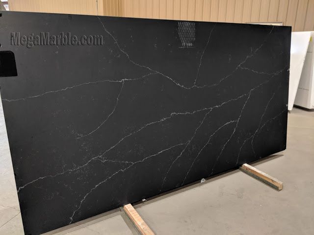 a large black marble counter top in a room