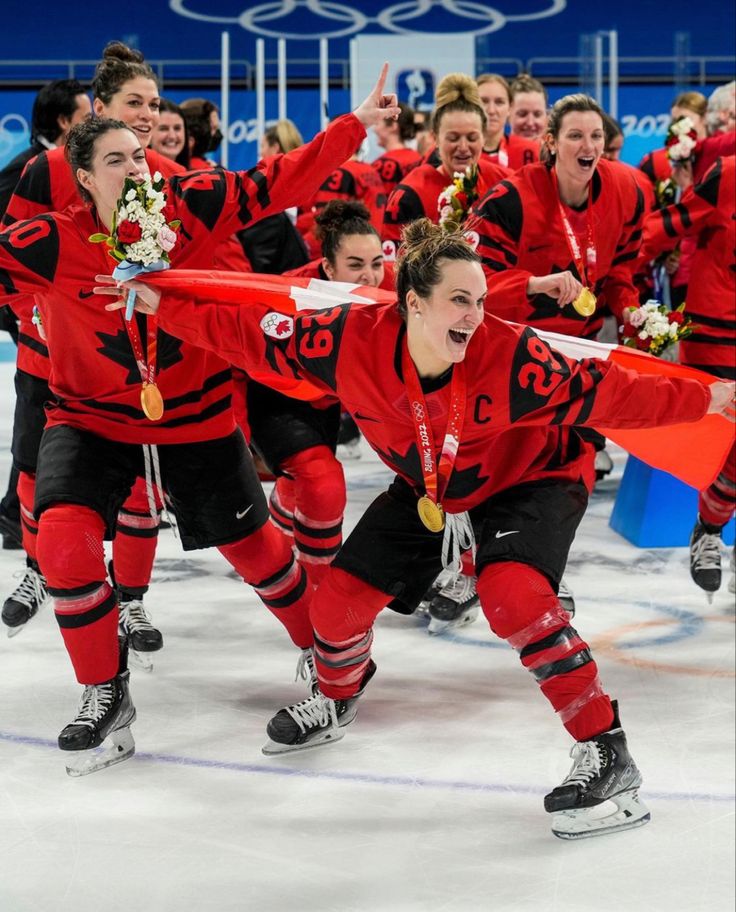 the canadian women's ice hockey team celebrates their gold medal