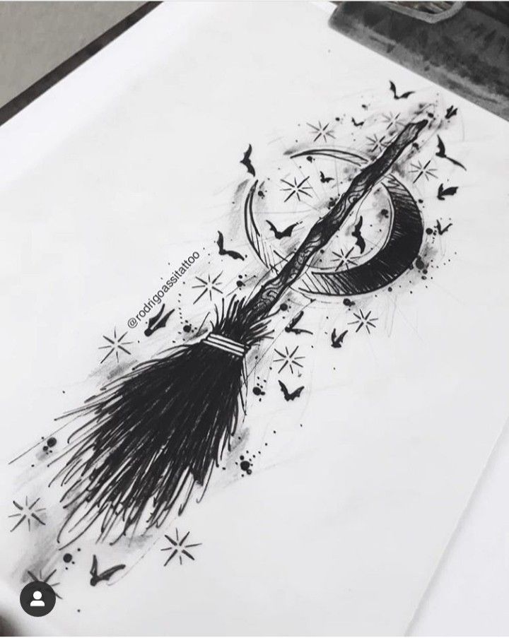 a black and white drawing of a broom with bats flying around it on top of a sheet of paper