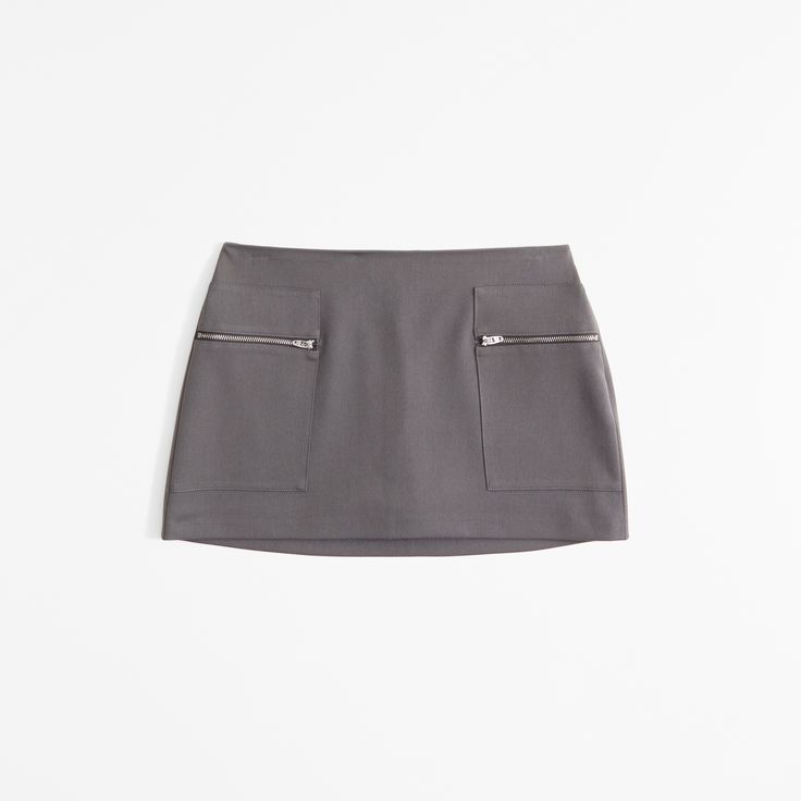 Elevate your wardrobe with the Abercrombie & Fitch Women's Mid Rise Zip Mini Skort, a perfect blend of style and practicality. This chic dark gray skort combines the elegance of a skirt with the comfort of shorts, making it an ideal choice for both casual outings and stylish events.

- Size: XL
- Color: Dark Gray
- Material: Body: Polyester, Lining: Polyester
- Gender: Female
- Features: Mid-rise, front pockets with zipper closure, elasticated waistband for a secure fit

Crafted with a soft poly Casual Mini Length Bottoms With Zipper, Casual Mini Bottoms With Zipper Closure, Casual Mini Bottoms With Zipper, Casual Skort With Zipper Closure For Spring, Casual Mini Skort With Zipper Closure, Casual Spring Skort With Zipper Closure, Spring Skort With Zipper Closure, Workwear Mini Skirt With Zip Fly, Fitted Short Length Skort With Zipper Closure