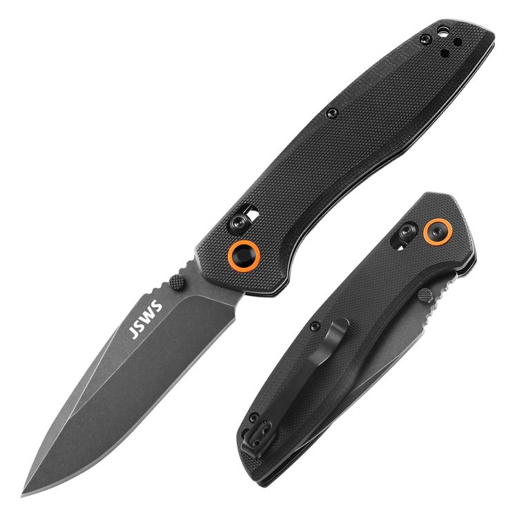 the knife is black and has two orange eyes on it's side, with an orange tip