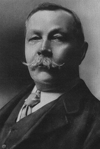 an old black and white photo of a man with a moustache on his face