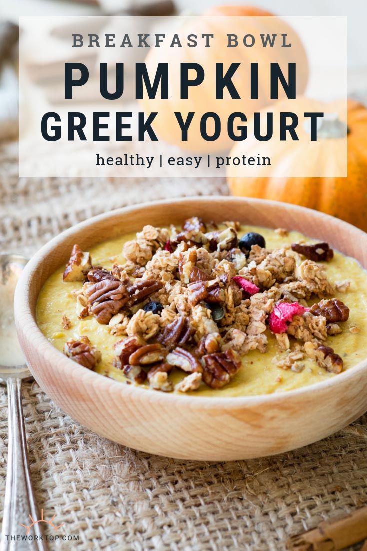 a bowl of pumpkin greek yogurt with pecans in the background and text overlay that reads, breakfast bowl pumpkin greek yogurt