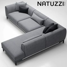 a couch that is sitting on top of a white surface with pillows and the words nattuzzi above it