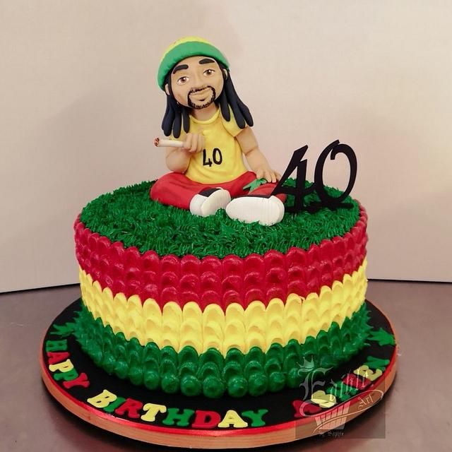 a cake with a man sitting on top of it and the number forty six in front of him