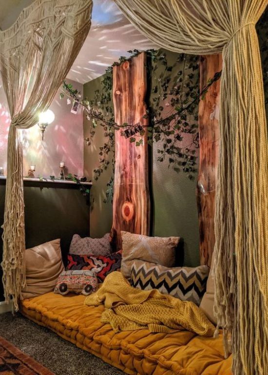 a canopy bed with pillows and blankets on it in a room that is decorated with wood planks