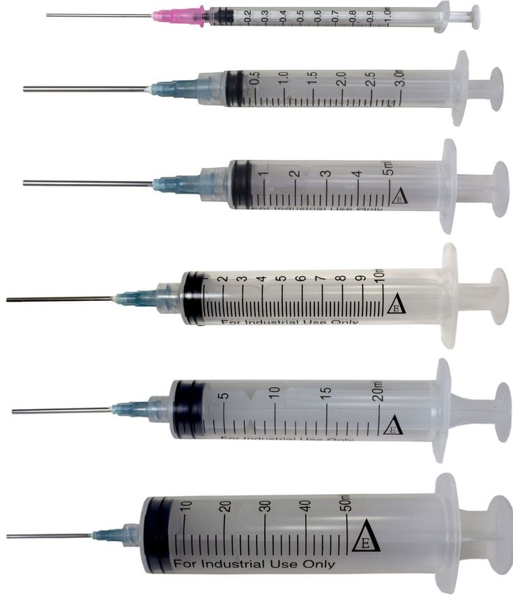 four sys are lined up next to each other with one needle in the middle