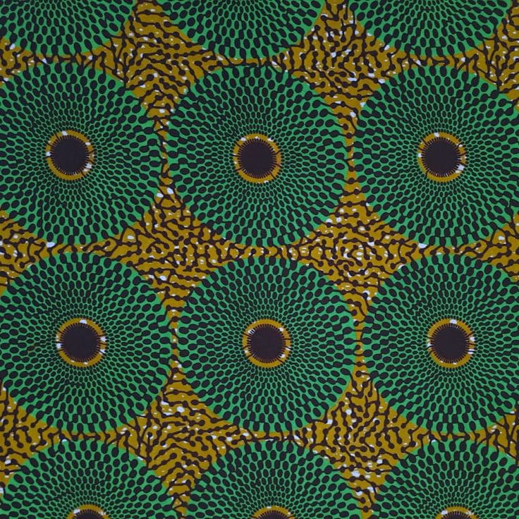 an image of a green and yellow pattern with circles in the center on a black background