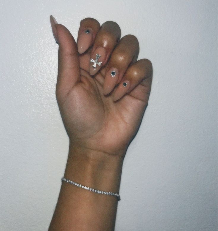 Nude base, acrylic, nails. Nails With Cross Charm, Nails With Cross, Nail Inspo Almond, Acrylic Nails Black, Chrome Cross, Cross Nails, Short Almond Nails, Black Gems, Gem Nails