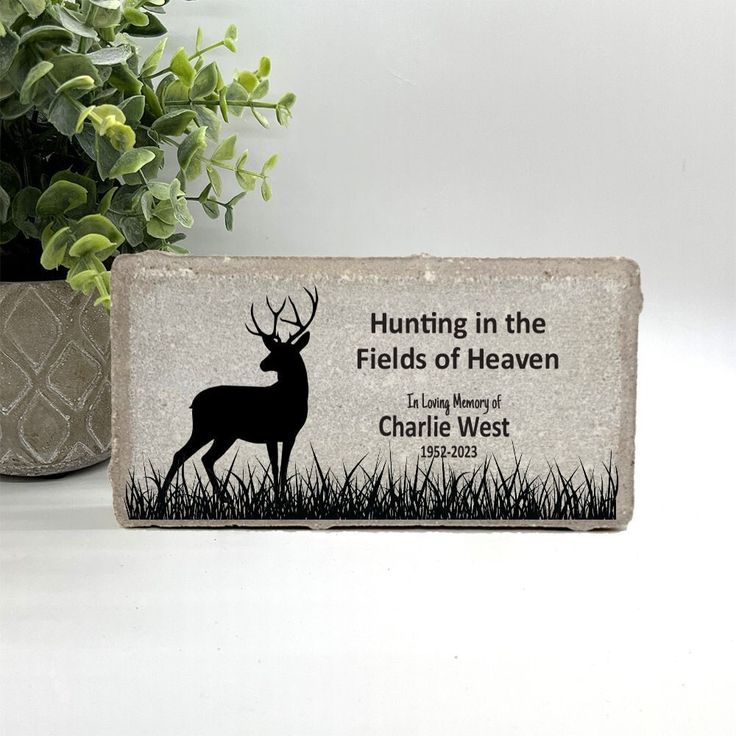 a rock with a deer on it and the words hunting in the fields of heaven