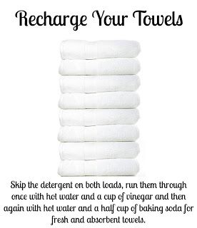 a stack of white towels with the words recharge your towels