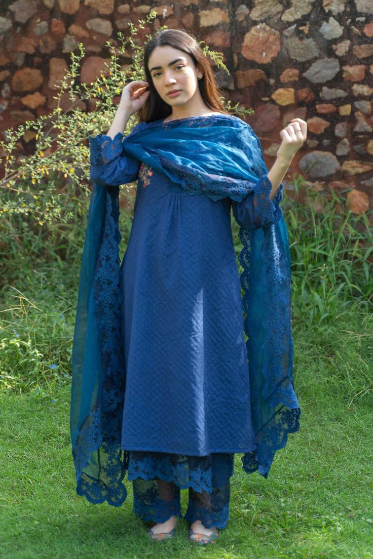 Blue straight kurta with embroidered floral motifs on yoke. Comes with inner, pant and sheer dupatta.
Component: 4
Embroidery
Neckline: Kurta: Round; Inner: Scoop
Sleeve Length: Kurta: Three fourth; Inner: Sleeveless
Fabric: Silk Chanderi, Cotton, Organza
Color: Blue
Floral embroidered scallop border on dupatta
Floral embroidered scallop hem on pant
Floral embroidered scallop hem on inner - Aza Fashions Sheer Dupatta, Embroidery Neckline, Scallop Border, Scallop Hem, Straight Kurta, Fabric Silk, Kurta Set, Blue Silk, Scalloped Hem