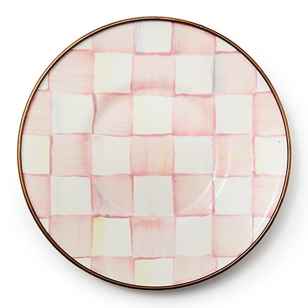 a pink and white checkered plate on a white background