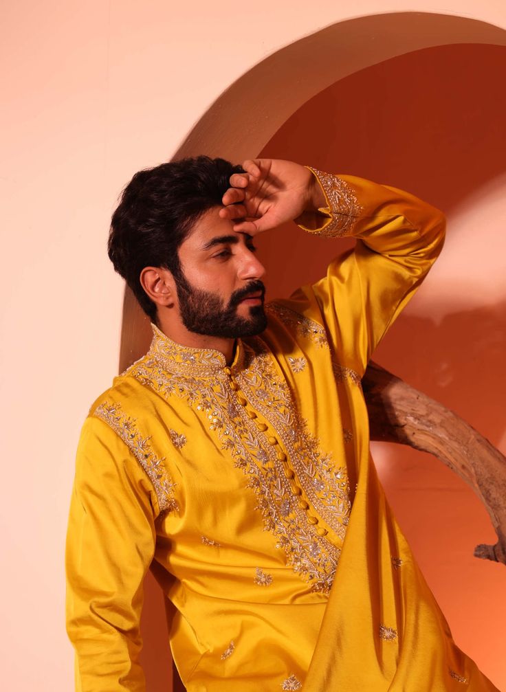 Featuring aain kurta with loop buttons and intricate hand embroidery over yoke, armhole and sleeves with inside lining. Consisting of mirror, bead, thread, sequence work. Bollywood Style Raw Silk Kaftan, Navratri Raw Silk Kurta With Intricate Embroidery, Traditional Raw Silk Kaftan For Designer Wear, Traditional Chanderi Kurta With Mirror Work, Traditional Raw Silk Nehru Jacket With Mirror Work, Traditional Nehru Jacket With Mirror Work In Raw Silk, Traditional Drape Kurta With Mirror Work For Eid, Bollywood Style Kurta With Traditional Drape And Mirror Work, Designer Kurta With Mirror Work For Navratri