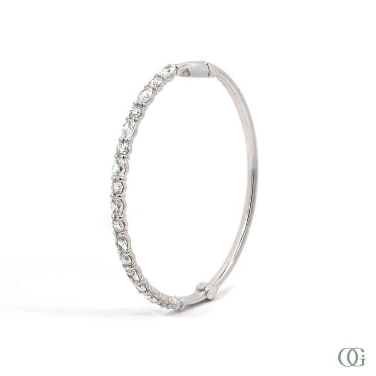 This stunning Oval and Round Diamond Bangle is crafted with oval and round diamonds, Perfect for a special occasion, this elegant design will add a touch of sophistication. The standard size is 7 inches; please note any other sizes are considered special order and may require additional time for production. Timeless Oval Diamond Bracelet, Oval Diamond Tennis Bracelet With Single Cut Diamonds, Formal Oval Bracelet With Single Cut Diamonds, Oval Diamond Bracelet With Accents, Oval Diamond Bracelet With Diamond Accents, Elegant Oval Tennis Bracelet With Single Cut Diamonds, Fine Jewelry Oval Diamond Bracelet With Accents, Formal Oval Tennis Bracelet With Single Cut Diamonds, Dazzling Oval Diamond Bracelet