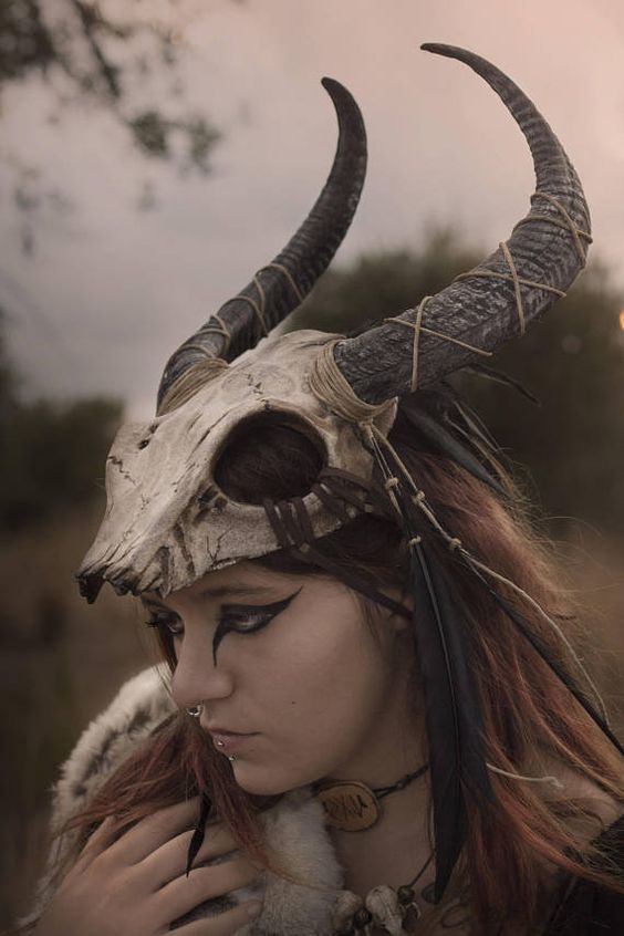 a woman wearing a horned helmet with horns