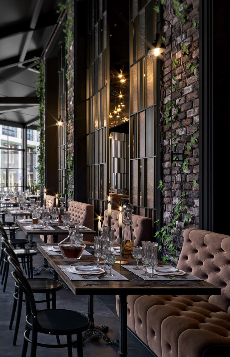 an empty restaurant with long tables and chairs