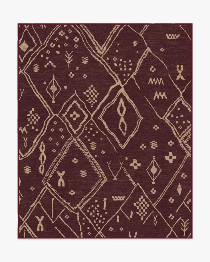 a brown and white rug with different designs on it