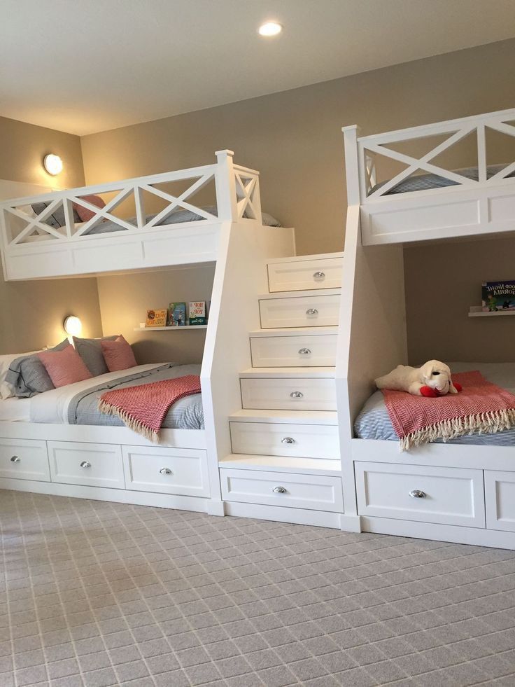 two bunk beds with drawers underneath them in a room that has carpeted flooring