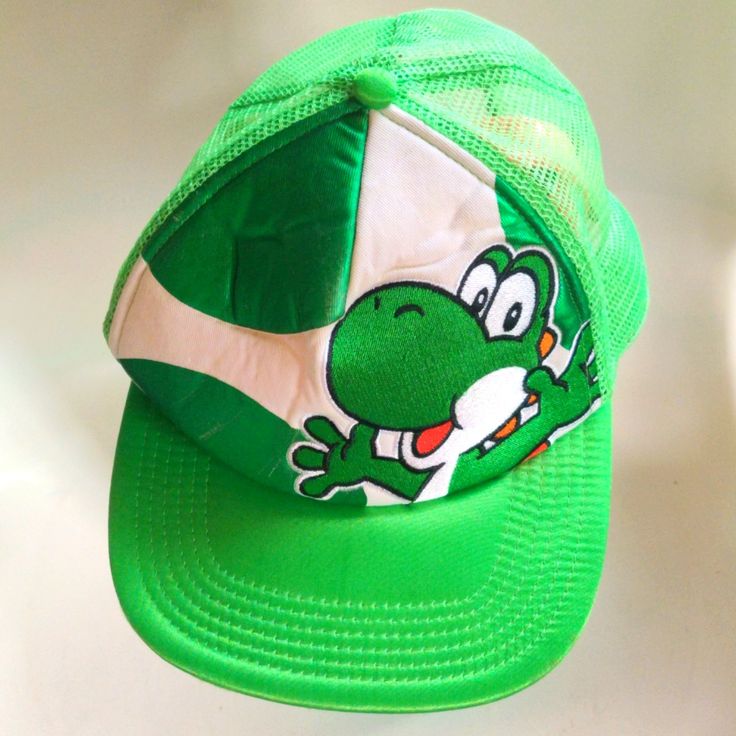 a green hat with a cartoon character on it