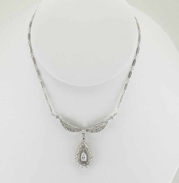 "Art Deco Necklace, Genuine Diamond Necklace, Vintage Necklace, 14K White Gold Necklace, Gold Chain, Diamond Pendant, Teardrop Pendant, April Birthstone, 1930s Necklace. This beautiful vintage Necklace & Pendant is finely crafted in solid 14K White Gold and set with white and fiery diamonds. The center pear cut diamond is .60 carat of SI2 clarity and G color. It is surrounded by 18 single cut diamonds of VS1 clarity and G color = .72 carat. Four round brilliant cut diamonds are SI1 clarity a Classic Teardrop Pendant Necklace For Formal Occasions, Classic Diamond Cut Pendant Bridal Necklace, Classic Teardrop Necklace For Anniversary, Elegant Oval Drop Necklace For Anniversary, Elegant Oval Drop Necklace For Formal Occasions, Classic Diamond Teardrop Pendant Necklace, Vintage Teardrop Diamond Jewelry, Classic Wedding Pendant Drop Necklace, Classic Cubic Zirconia Drop Necklace For Anniversary