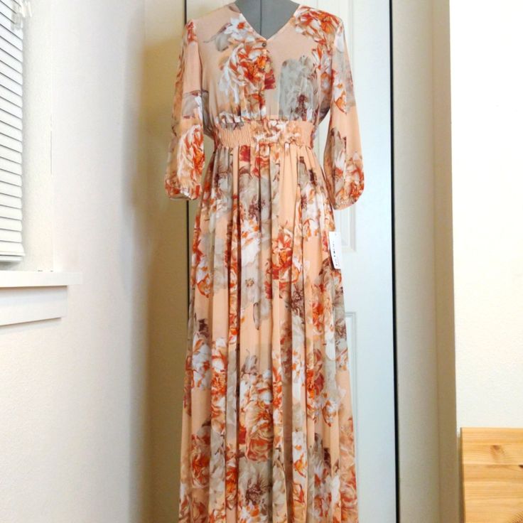 Very Nice Bohemian Maxi Dress. Would Look Chic With A Belt Or As Is. Purchased This For A Relative Who Ended Up Not Wearing It. New With Tags. Size: 4 Small, Would Fit A Medium As The Waist Has Elastic. Semi Transparent, Would Need A Slip Underneath. Apricot Floral Print Maxi Dress For Brunch, Elegant Flowy Peach Maxi Dress, Spring Apricot Maxi Dress With Floral Print, Bohemian Apricot V-neck Dress, Apricot Bohemian V-neck Dress, Spring Apricot Chiffon Dress, Peach Maxi Dress For Brunch, Spring Flowy Peach Dresses, Flowy Peach Maxi Dress