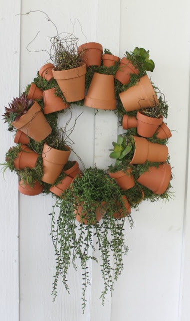 a wreath made out of potted plants