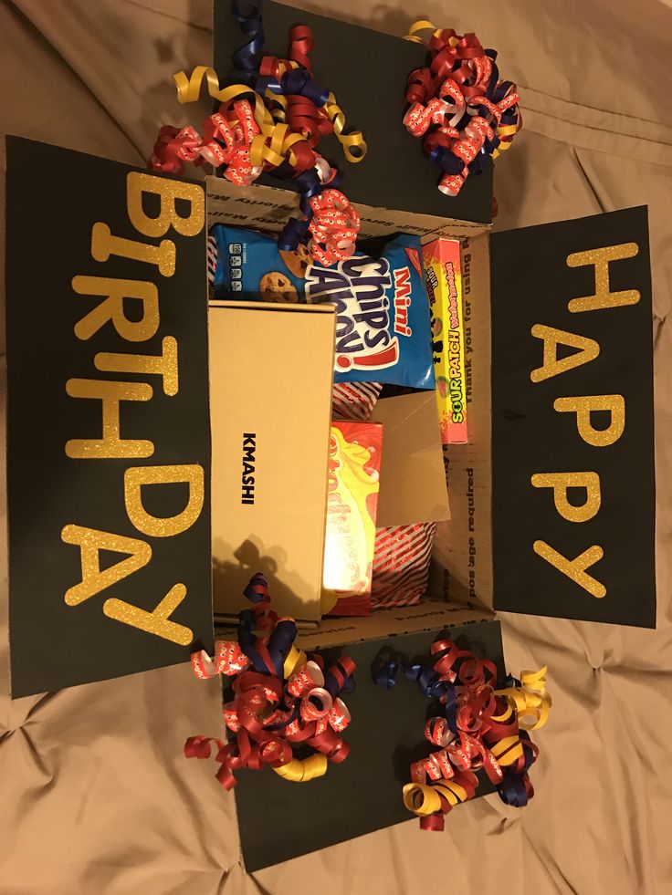 an open birthday box filled with candy and candies