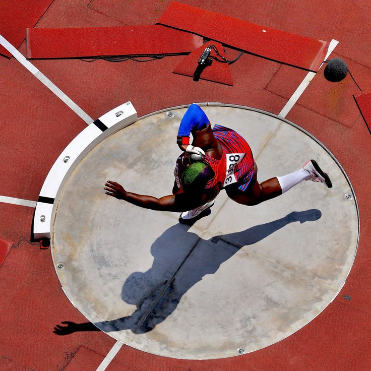 a man is doing tricks on a skateboard in the middle of an obstacle course