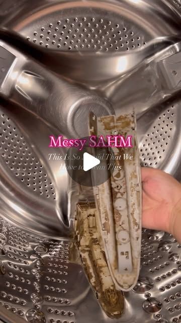 a person is holding something in front of a washer with the words messy sahm on it