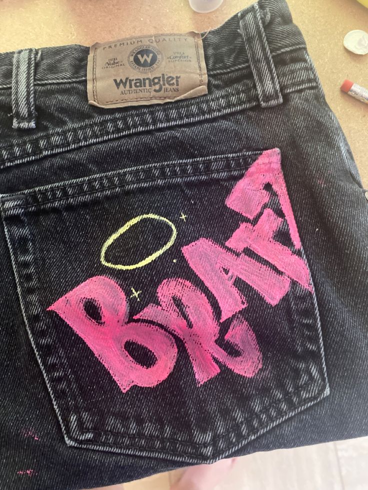 the back pocket of a pair of jeans with writing on it that says, baby